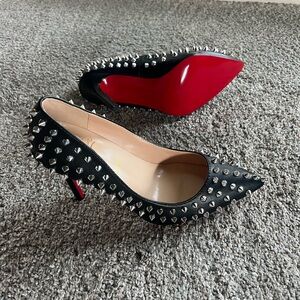 Spike studded red bottom stiletto heels